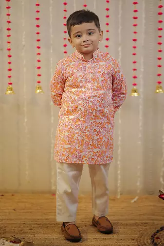 Peach orange block printed kurta set.