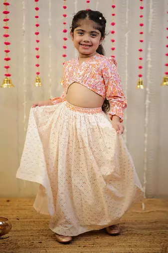Peach orange block printed crop top with skirt.