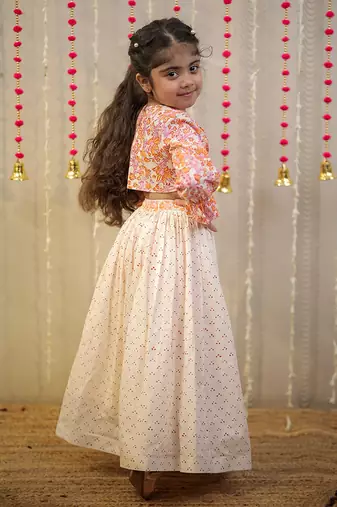 Peach orange block printed crop top with skirt.