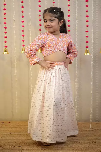 Peach orange block printed crop top with skirt.