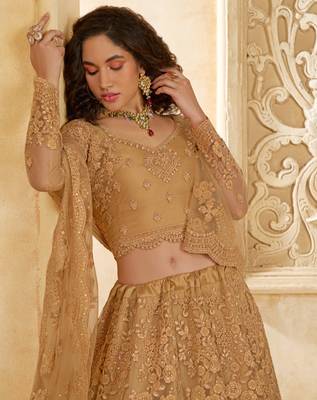 Spellbinding Golden Cording & Thread Embroidered With Stone Work Net With Silk Inner Lehenga Choli For Wedding 3