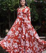 Orange beautiful designer floral printed long gown for partywear looks