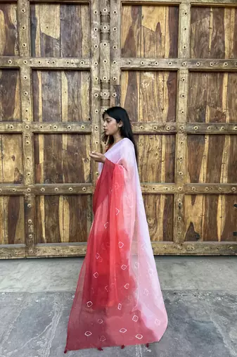 Grace and tradition meet in the exquisite Kota Doria Ombre Saree.