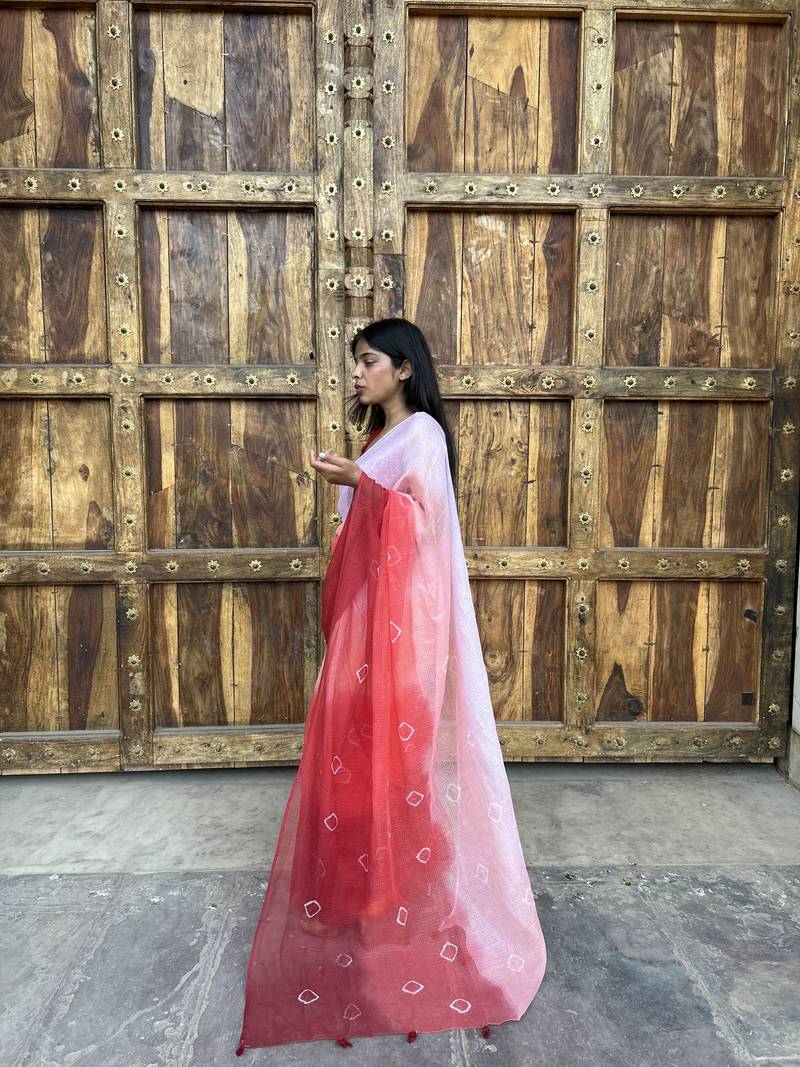 Grace and tradition meet in the exquisite Kota Doria Ombre Saree.