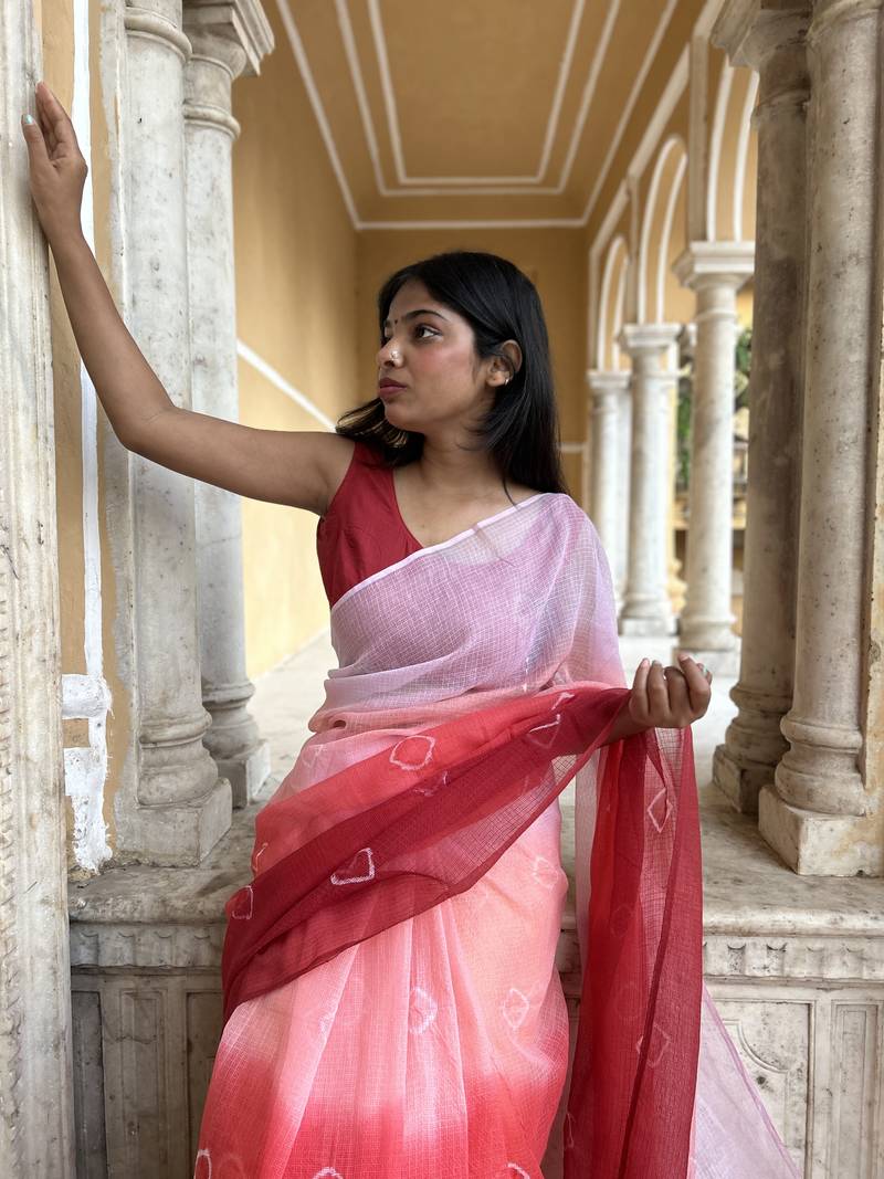 Grace and tradition meet in the exquisite Kota Doria Ombre Saree.