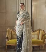 Designer cream hand worked tissue silk saree with blouse