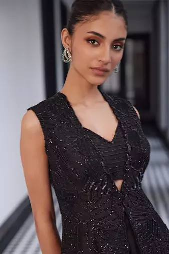 tone on tone emb on waistcoat and organza lengha and embellished bustier