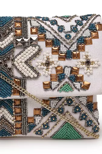 Tribal white & multi ethnic motifs embellished cotton canvas sling bag