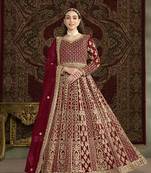 Embroidered net maroon floor length gown