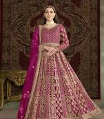 Embroidered net rani pink floor length gown
