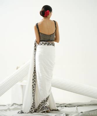 White floral border saree paired with black geometric cutdana blouse 5