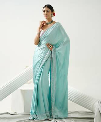 Ocean green sequin saree with border work paired with shaded sequin pink blouse 1