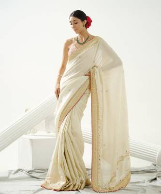 Gold silk tissue saree handrafted with sequin , cutdana paired with gold sequin embellished strap crossback blouse 1