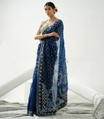 Blue organza floral handcrafted saree paired with sea blue geometric sequin blouse