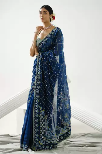 Blue organza floral handcrafted saree paired with sea blue geometric sequin blouse