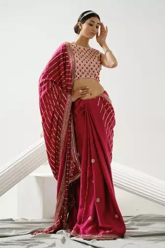 Cherry pink linear handcrafted saree paired with satin incut handcrafted blouse