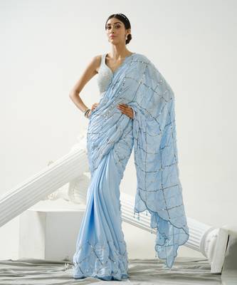 Powder blue sequin scallop saree paired with steel grey sequin strap blouse 1
