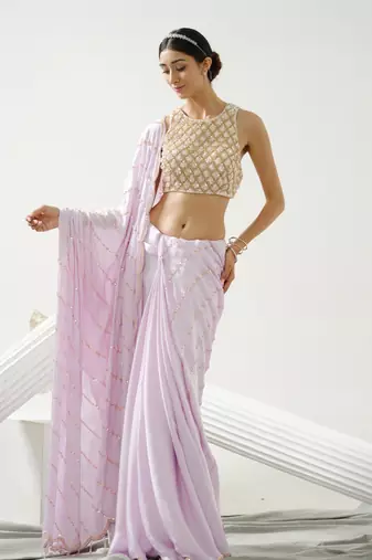 Lilac sequin scallop saree paired with lilac incut crystal blouse