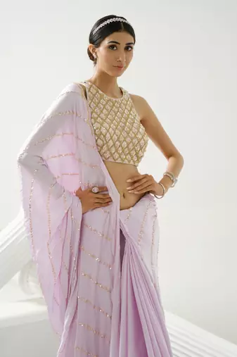 Lilac sequin scallop saree paired with lilac incut crystal blouse