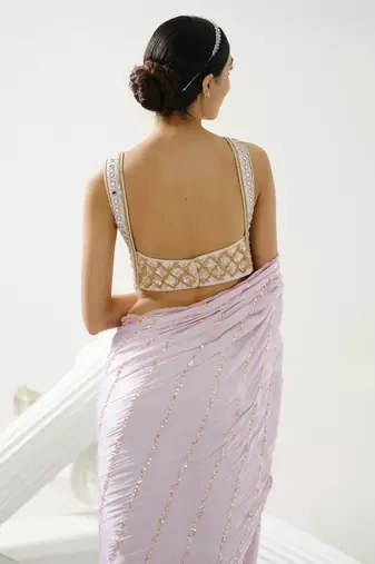 Lilac sequin scallop saree paired with lilac incut crystal blouse