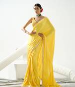 Yellow crystal and sequin handcrafted saree paired with sequin strap blouse