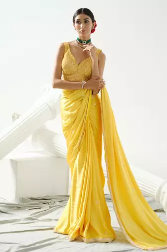 Yellow crystal and sequin handcrafted saree paired with sequin strap blouse