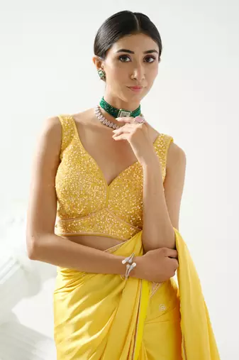 Yellow crystal and sequin handcrafted saree paired with sequin strap blouse