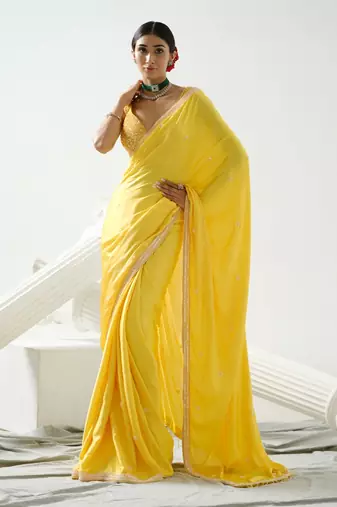 Yellow crystal and sequin handcrafted saree paired with sequin strap blouse
