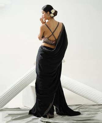 Black geometric satin silk saree paired with a sequin embellished  cross back strap blouse 4