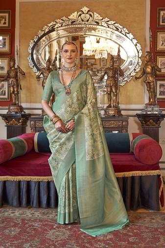 Cream and sea green tussar silk digital print zari border contemporary saree