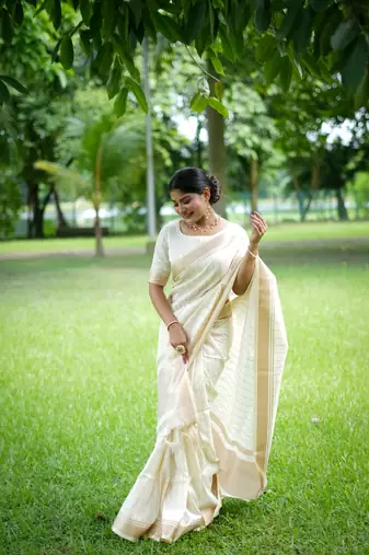 White Raw Silk Saree With All Over Zari Weaving Pattern With Running Blouse Piece
