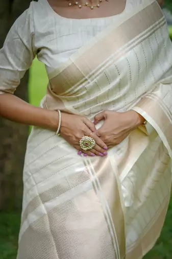 White Raw Silk Saree With All Over Zari Weaving Pattern With Running Blouse Piece