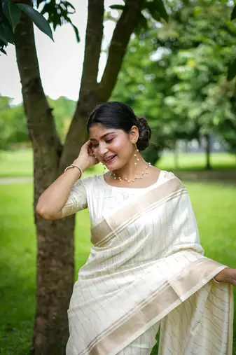 White Raw Silk Saree With All Over Zari Weaving Pattern With Running Blouse Piece