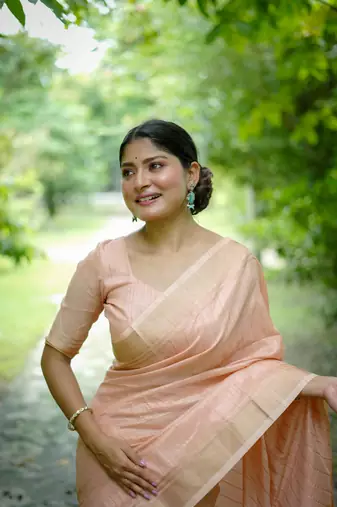 Peach Raw Silk Saree With All Over Zari Weaving Pattern With Running Blouse Piece