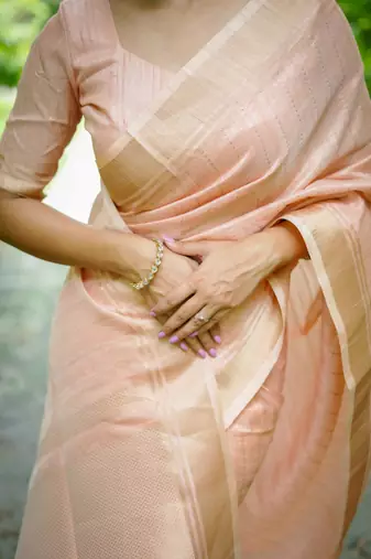 Peach Raw Silk Saree With All Over Zari Weaving Pattern With Running Blouse Piece