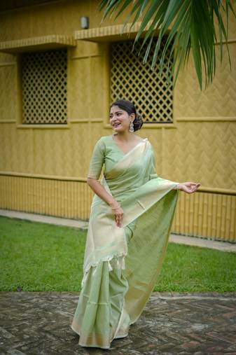 Pista Green Raw Silk Saree With All Over Zari Weaving Pattern With Running Blouse Piece