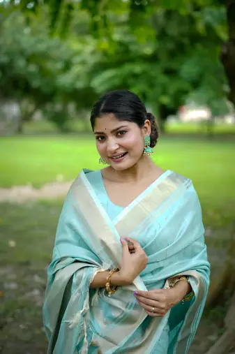 Sky Blue Raw Silk Saree With All Over Zari Weaving Pattern With Running Blouse Piece