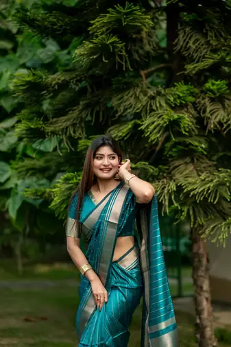 Teal Raw Silk Saree With All Over Zari Weaving Pattern With Running Blouse Piece