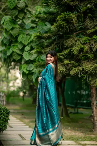 Teal Raw Silk Saree With All Over Zari Weaving Pattern With Running Blouse Piece