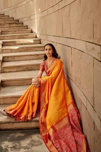 Orange Soft Khadi Raw Silk With Patola Weaving Pallu And Zari Weaving Border With Blouse