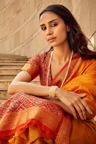 Orange Soft Khadi Raw Silk With Patola Weaving Pallu And Zari Weaving Border With Blouse