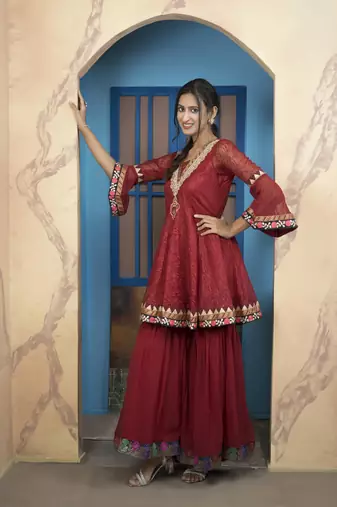 Maroon net embroidered a line kurta &