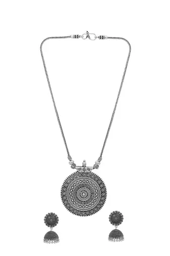 Oxidised silver-plated jewelry set with circular textured centerpiece and jhumkas