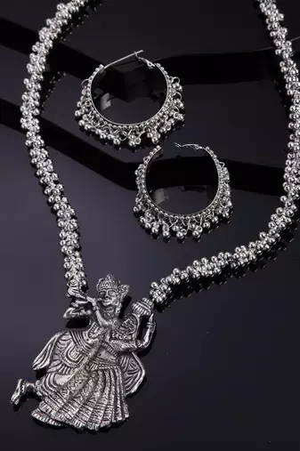 Oxidised silver-plated traditional jewelry set with radha-krishna motifs