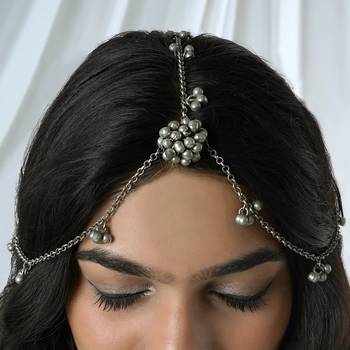 Silver oxidised maang tikka with intricate details and ghungroo accents 1