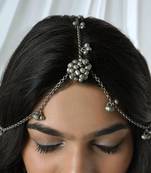 Silver oxidised maang tikka with intricate details and ghungroo accents