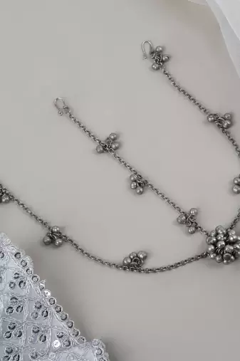Silver oxidised maang tikka with intricate details and ghungroo accents