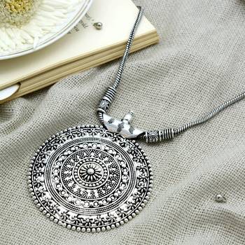 Silver oxidized long necklace with circular embossed pendant 1