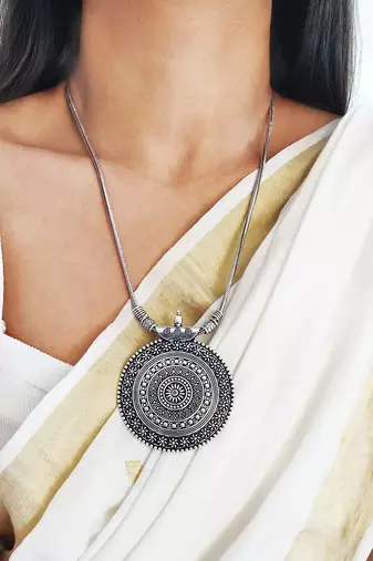 Silver oxidized long necklace with circular embossed pendant
