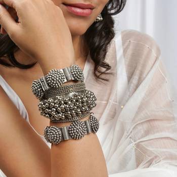 Stacked bracelet set with traditional motifs and contemporary design 1